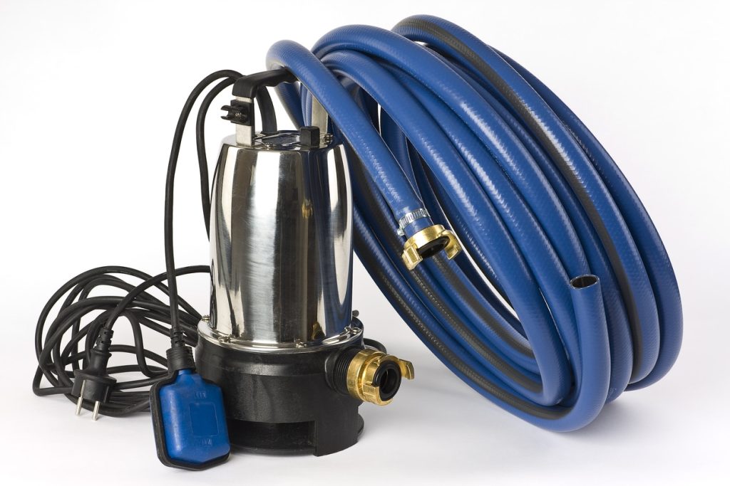 A submersible pump for dirty water and a blue water hose shown on a white background.